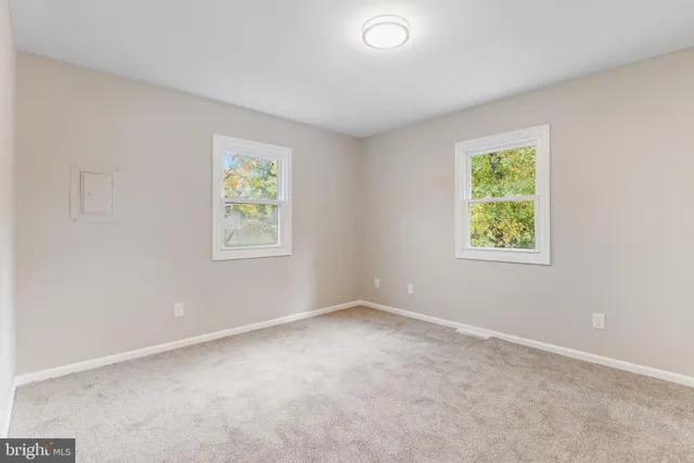 an empty room with windows