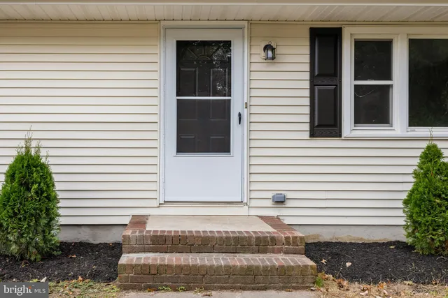 a view of a house with a yard and a window