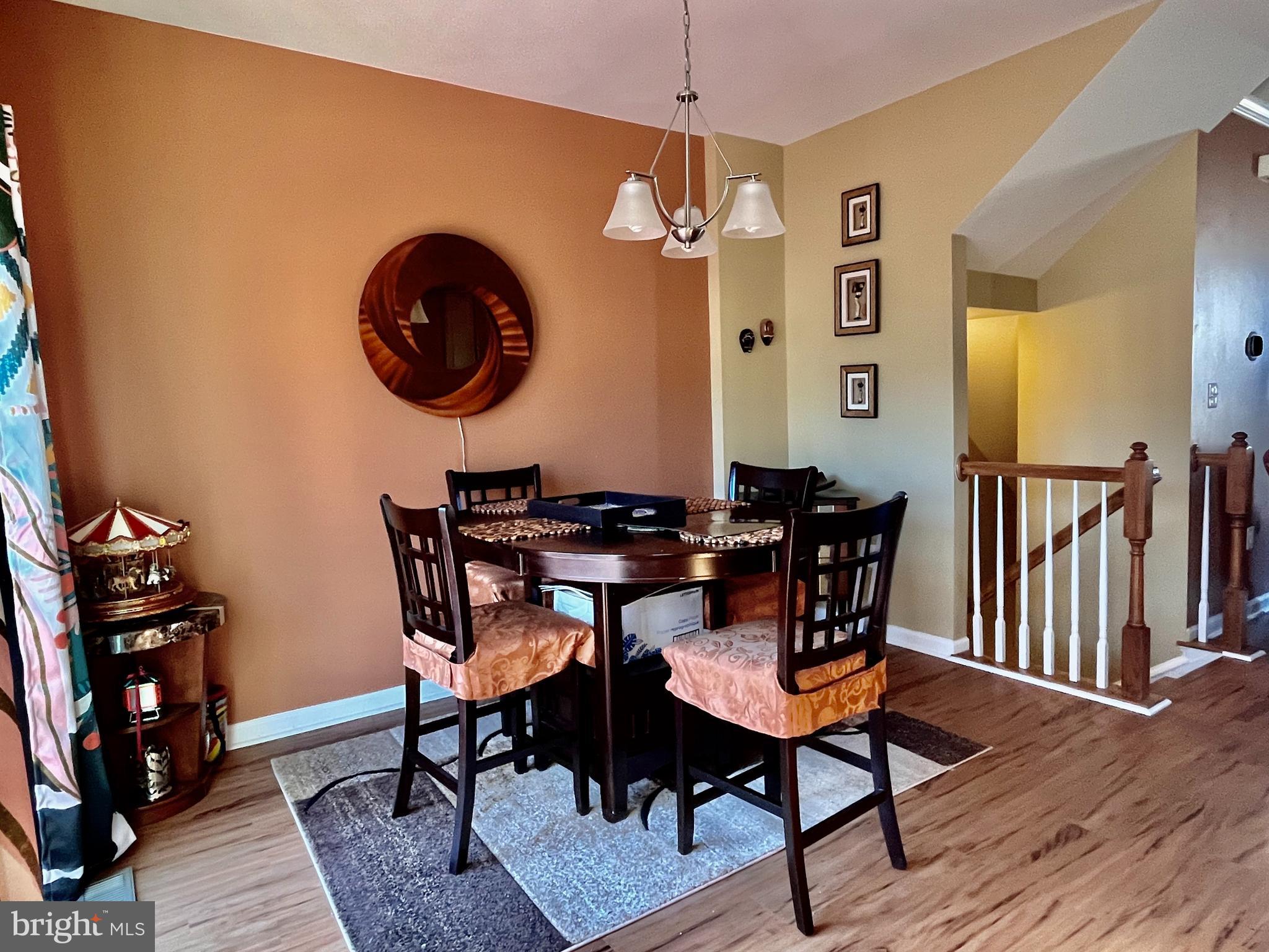 312 Spring Park Lane, Unit 59 Fredericksburg, VA 22405 - Photo 13 of 20 a dining room with furniture and wooden floor