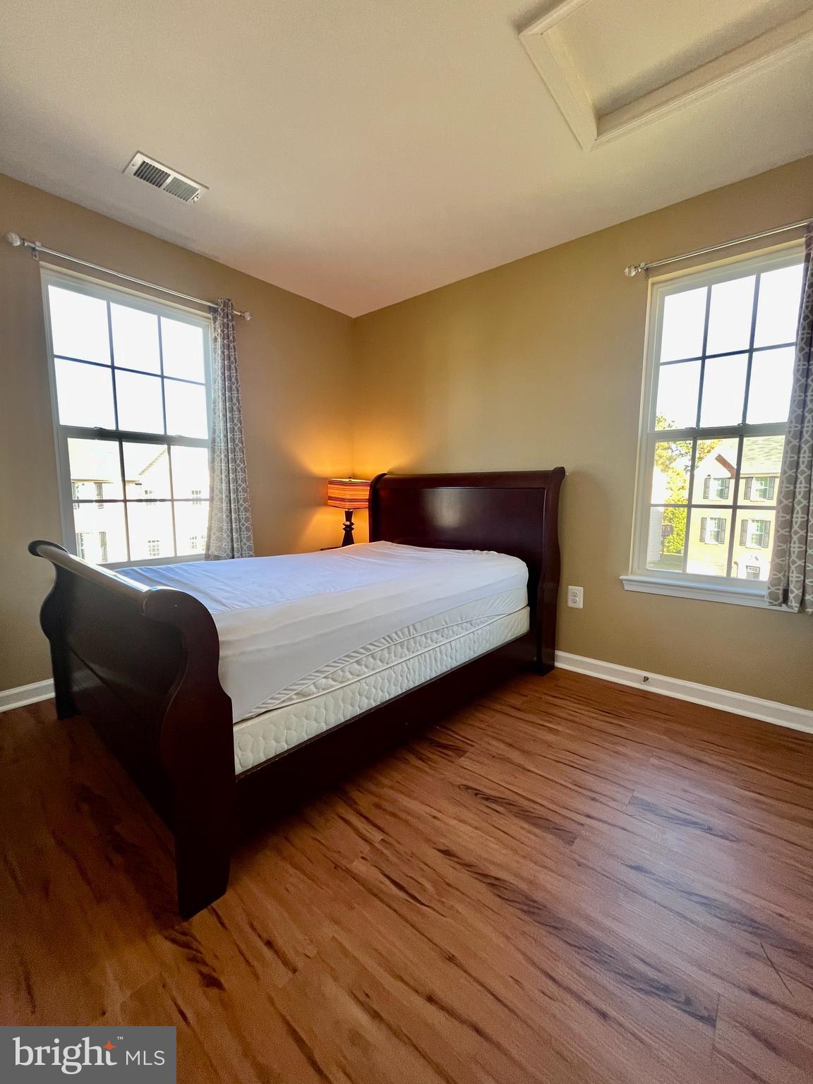 312 Spring Park Lane, Unit 59 Fredericksburg, VA 22405 - Photo 17 of 20 a bedroom with a bed and a window