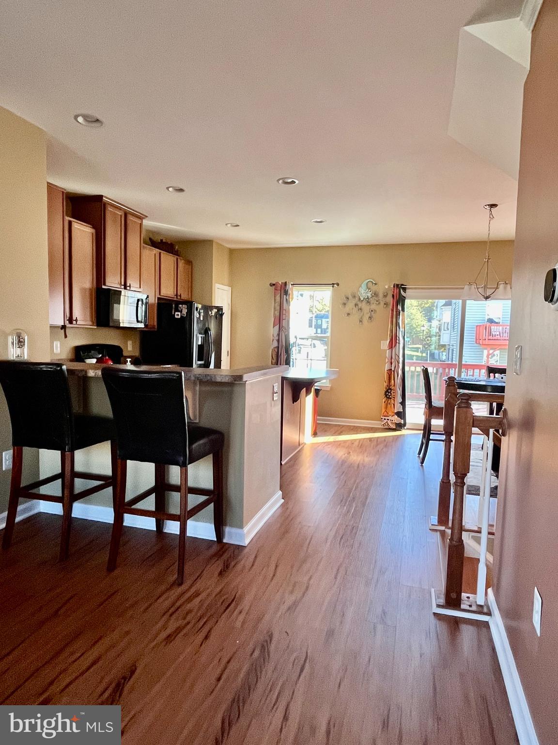 312 Spring Park Lane, Unit 59 Fredericksburg, VA 22405 - Photo 8 of 20 a view of a dining room with furniture window and wooden floor