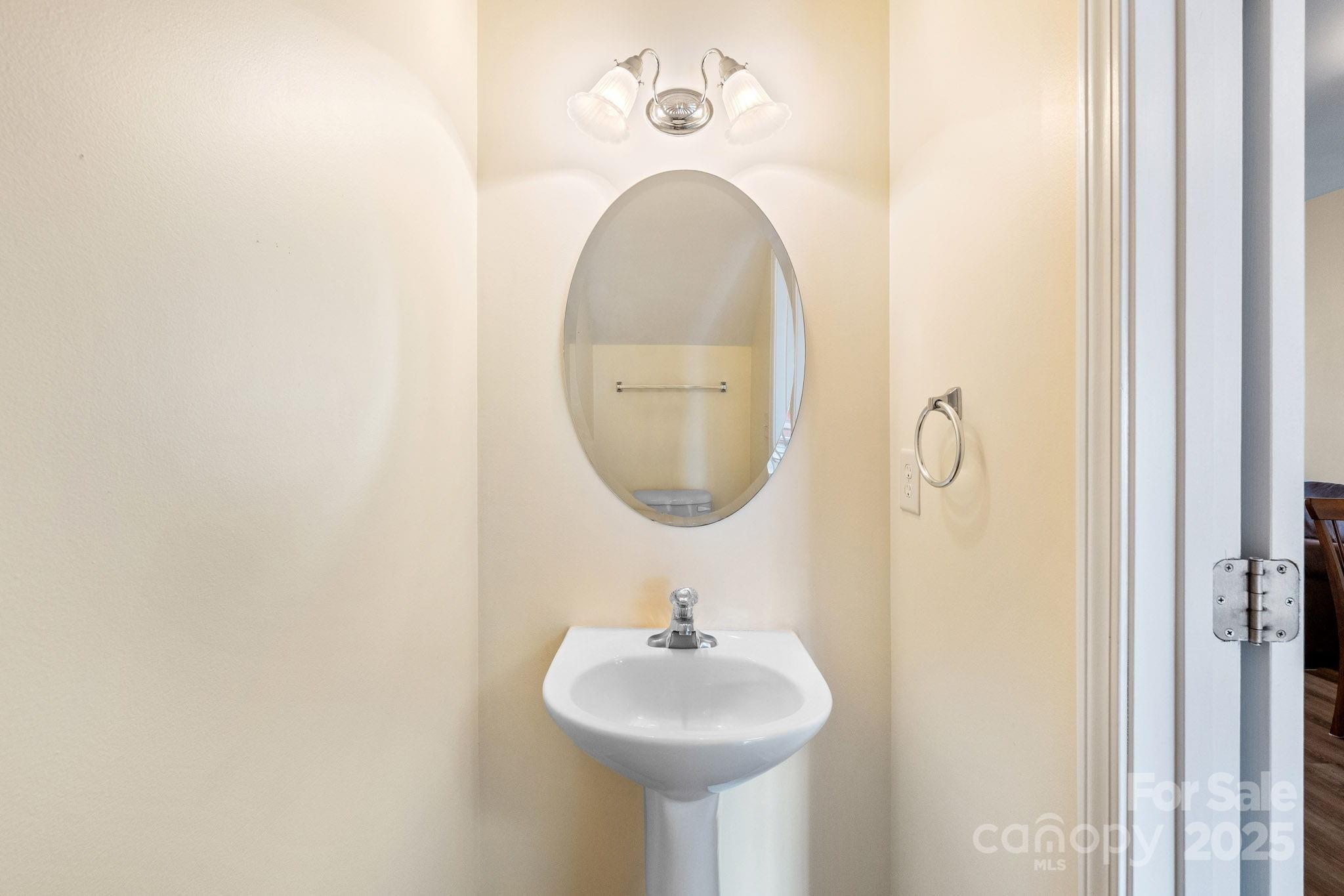 811 Gentlewinds Court Fort Mill, SC 29708 - Photo 15 of 25 a bathroom with a sink and a mirror