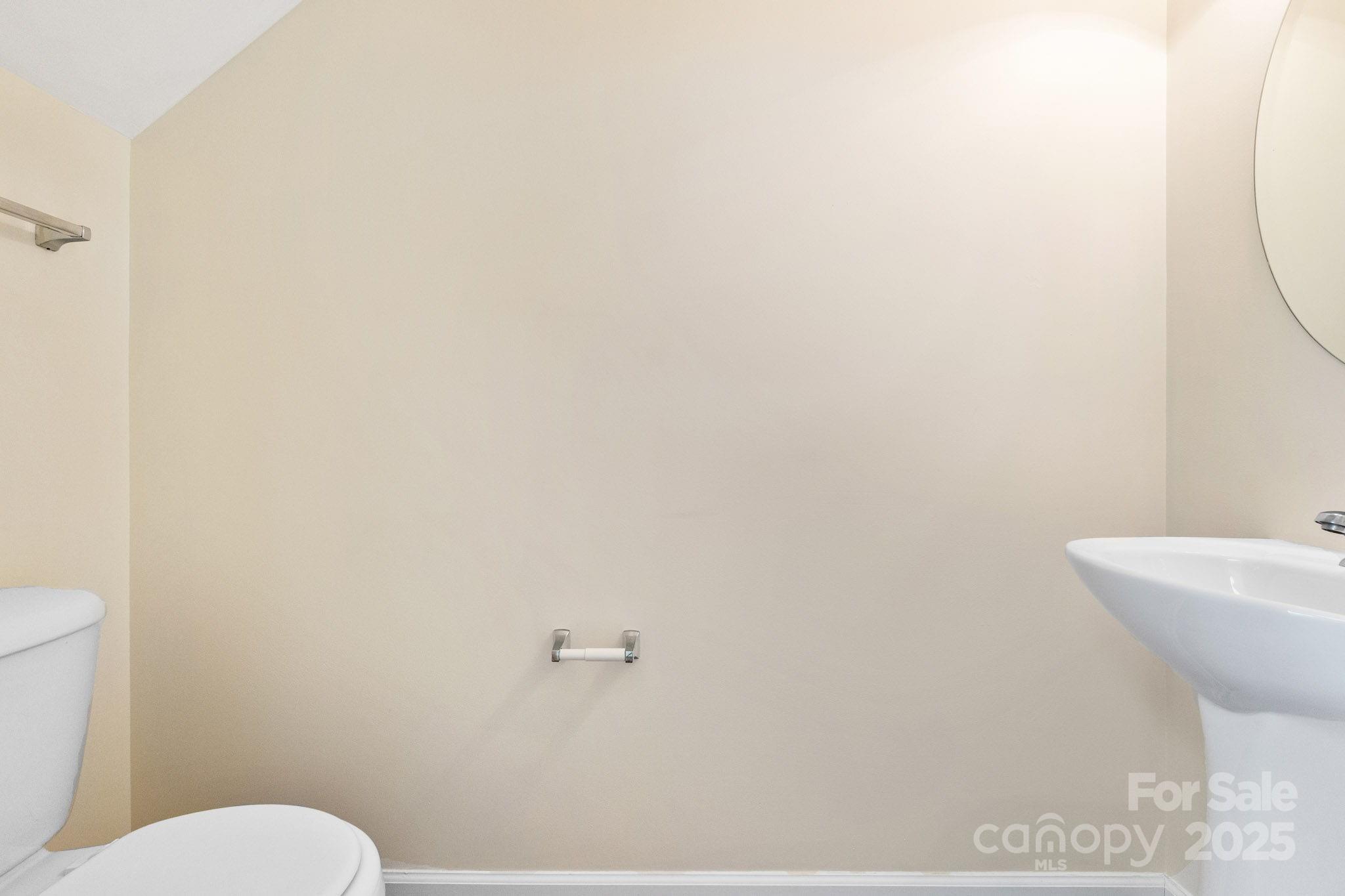 811 Gentlewinds Court Fort Mill, SC 29708 - Photo 16 of 25 a white toilet sitting next to a white wall