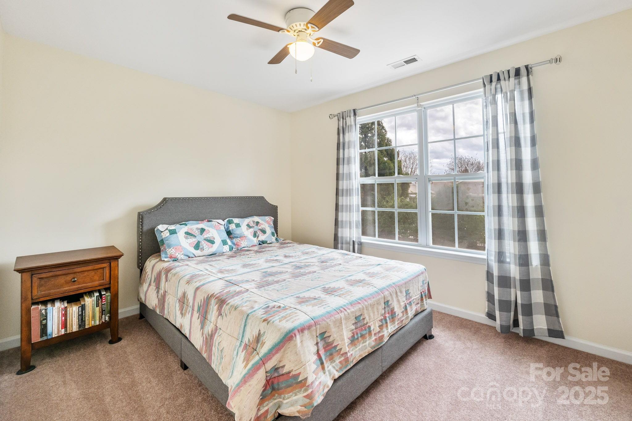 811 Gentlewinds Court Fort Mill, SC 29708 - Photo 18 of 25 a bedroom with a bed and a window