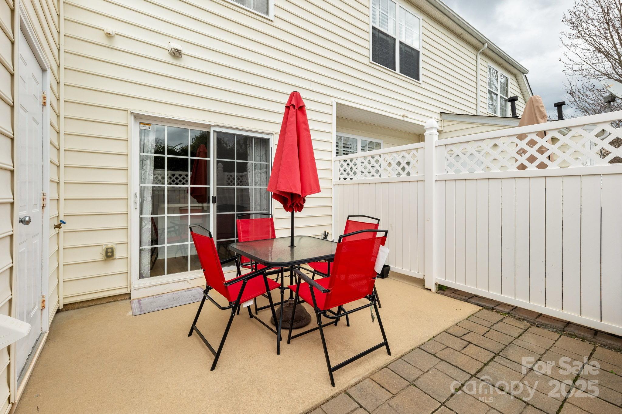 811 Gentlewinds Court Fort Mill, SC 29708 - Photo 23 of 25 a view of a chairs and table in the back yard of the house