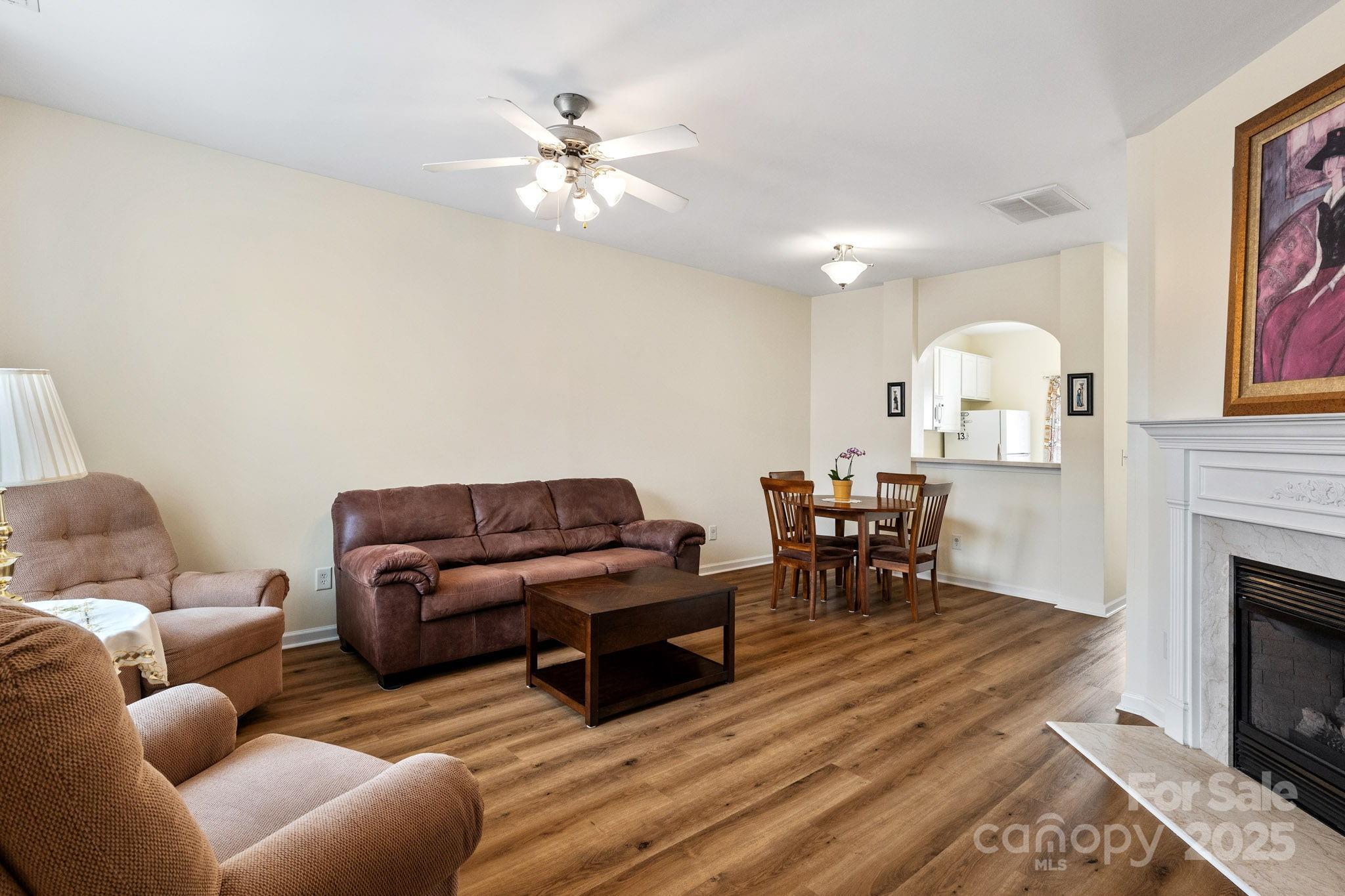 811 Gentlewinds Court Fort Mill, SC 29708 - Photo 4 of 25 a living room with furniture and a fireplace