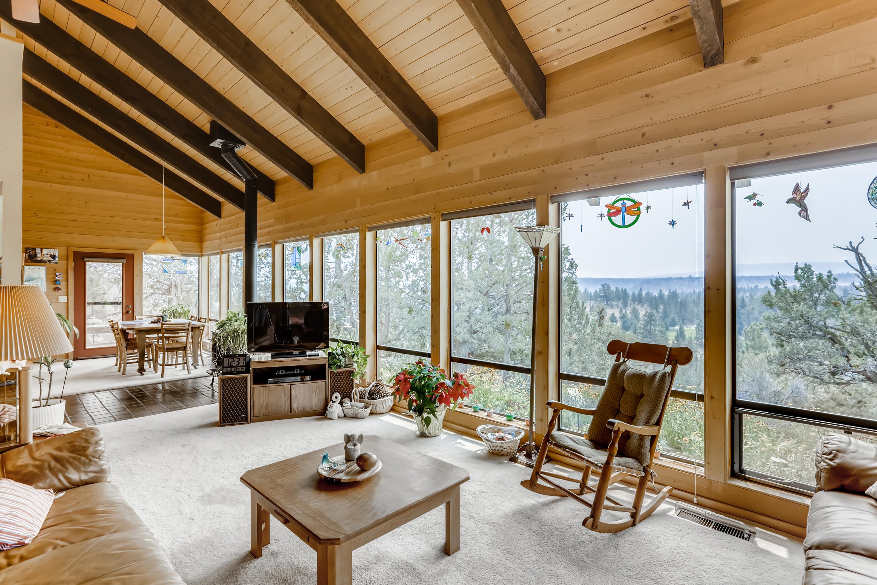 Check out these views through the picture windows. And, the vaulted wood ceiling.