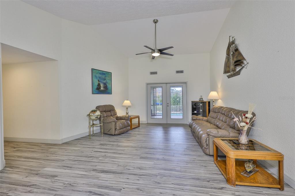 913 Allegro Lane Apollo Beach, FL 33572 - Photo 12 of 57 a living room with furniture and a wooden floor