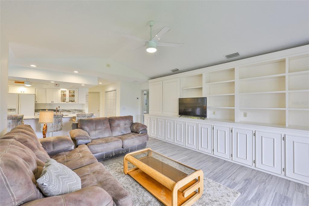 913 Allegro Lane Apollo Beach, FL 33572 - Photo 14 of 57 a living room with furniture and a flat screen tv