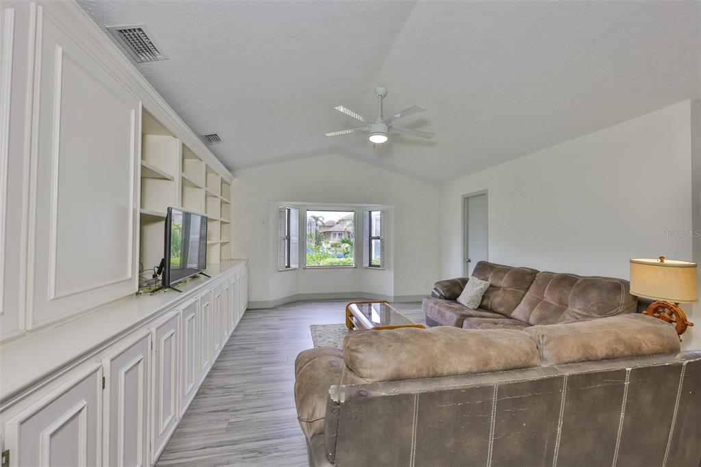 913 Allegro Lane Apollo Beach, FL 33572 - Photo 15 of 57 a bedroom with a bed and a large window with the outer view