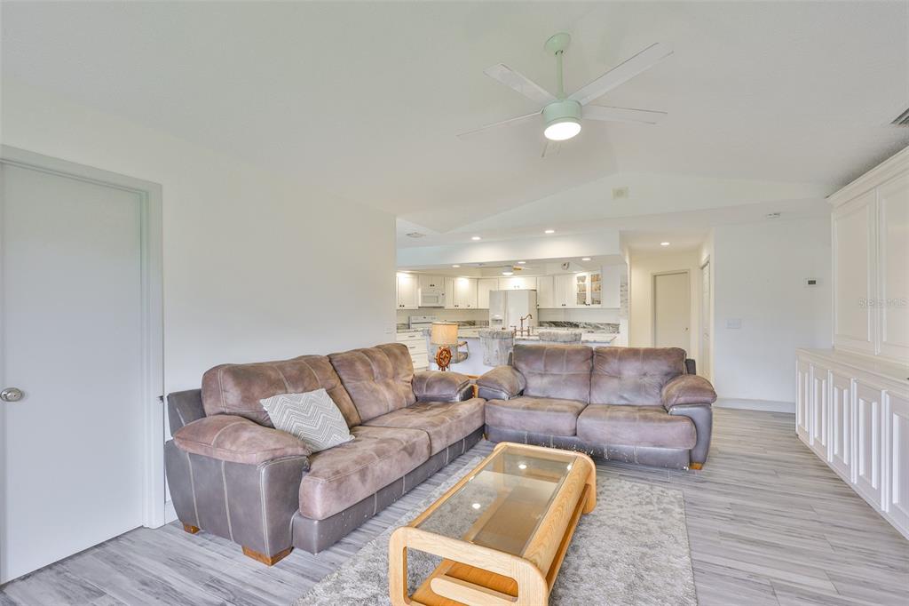 913 Allegro Lane Apollo Beach, FL 33572 - Photo 17 of 57 a living room with furniture and a wooden floor