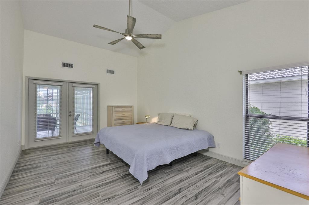 913 Allegro Lane Apollo Beach, FL 33572 - Photo 25 of 57 a bedroom with a bed and window