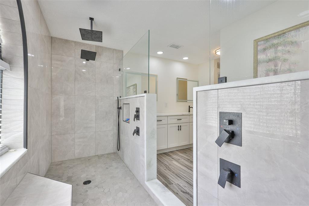 913 Allegro Lane Apollo Beach, FL 33572 - Photo 26 of 57 a bathroom with a shower and a mirror