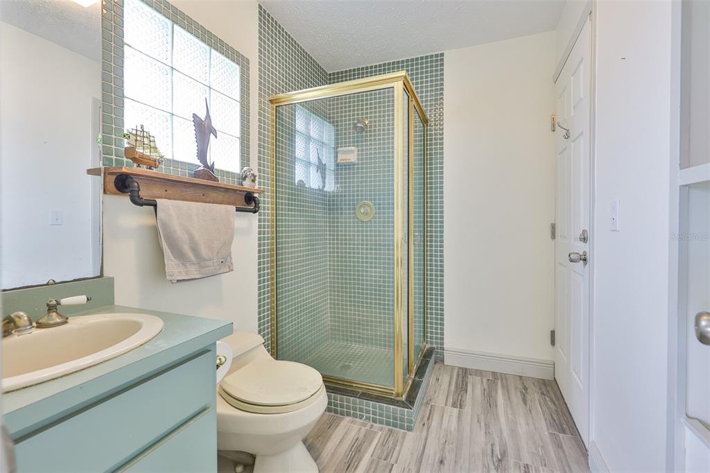 913 Allegro Lane Apollo Beach, FL 33572 - Photo 31 of 57 a bathroom with a sink toilet and shower