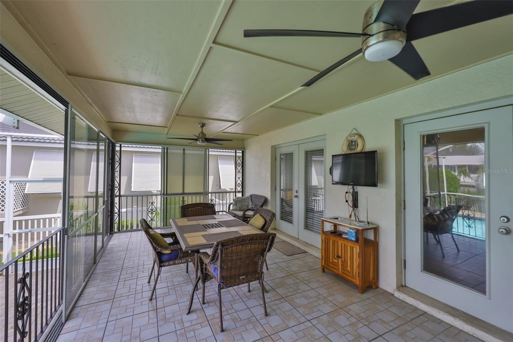 913 Allegro Lane Apollo Beach, FL 33572 - Photo 33 of 57 a outdoor space with furniture a flat screen tv