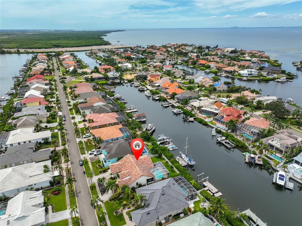 913 Allegro Lane Apollo Beach, FL 33572 - Photo 4 of 57 an aerial view of lake and residential houses with outdoor space
