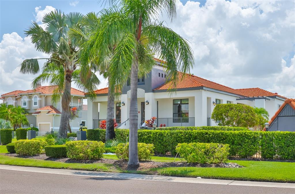 913 Allegro Lane Apollo Beach, FL 33572 - Photo 49 of 57 a front view of a house with a garden