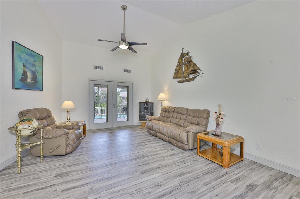 913 Allegro Lane Apollo Beach, FL 33572 - Photo 10 of 57 a living room with furniture and a wooden floor