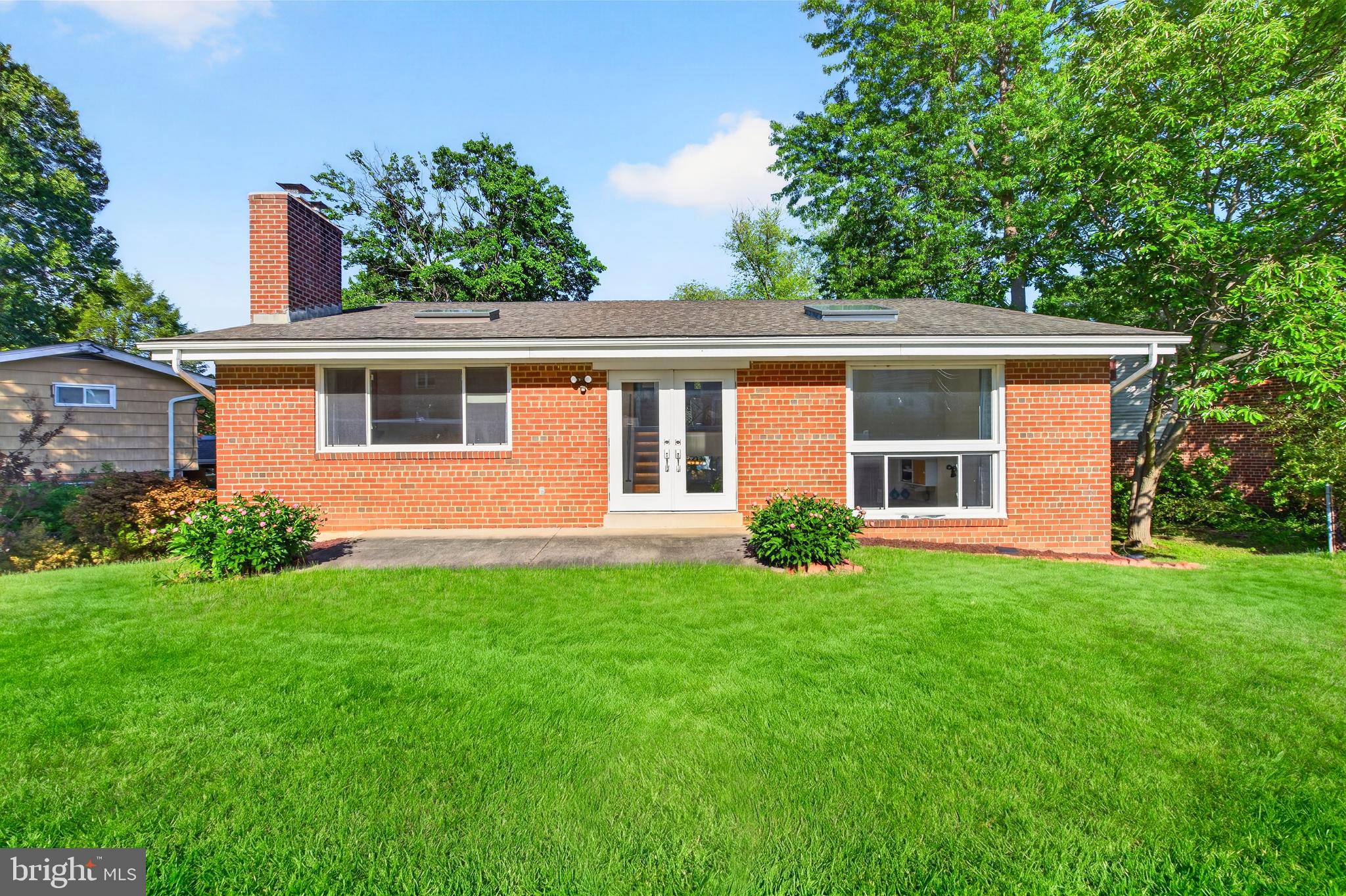 914 Kenbrook Court Silver Spring, MD 20902 - Photo 33 of 35 front view of a house with a yard