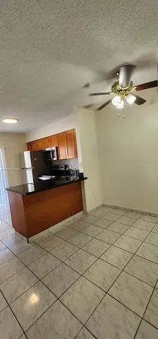 a view of kitchen with furniture
