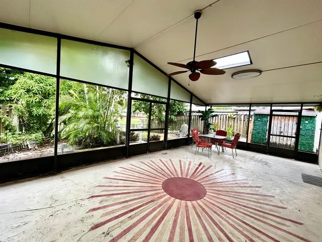 a view of a livingroom with furniture and window
