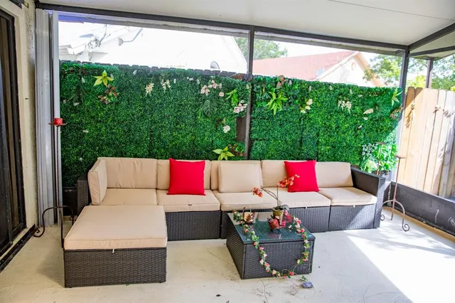 a outdoor living space with furniture and garden view