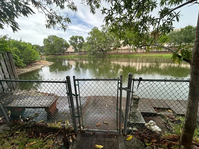 a view of a lake in between two chairs