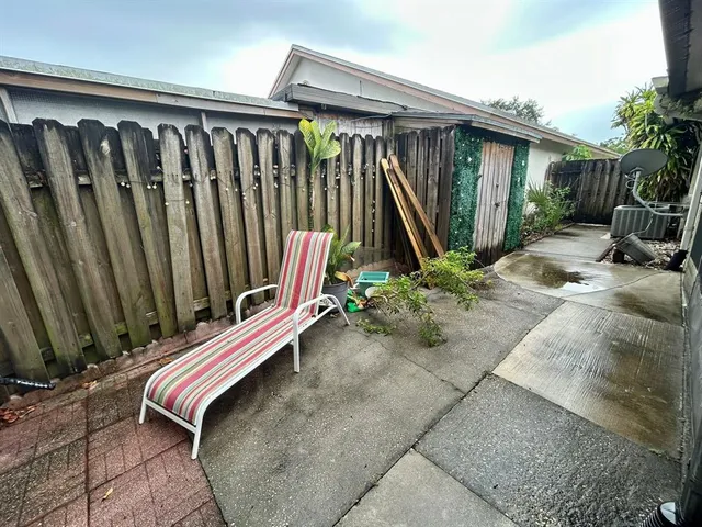 a spacious bathroom with a sink a toilet a mirror and bathtub