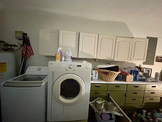 a spacious bedroom with a bed and furniture