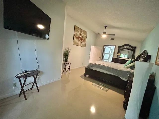 a view of living room with furniture and a flat screen tv