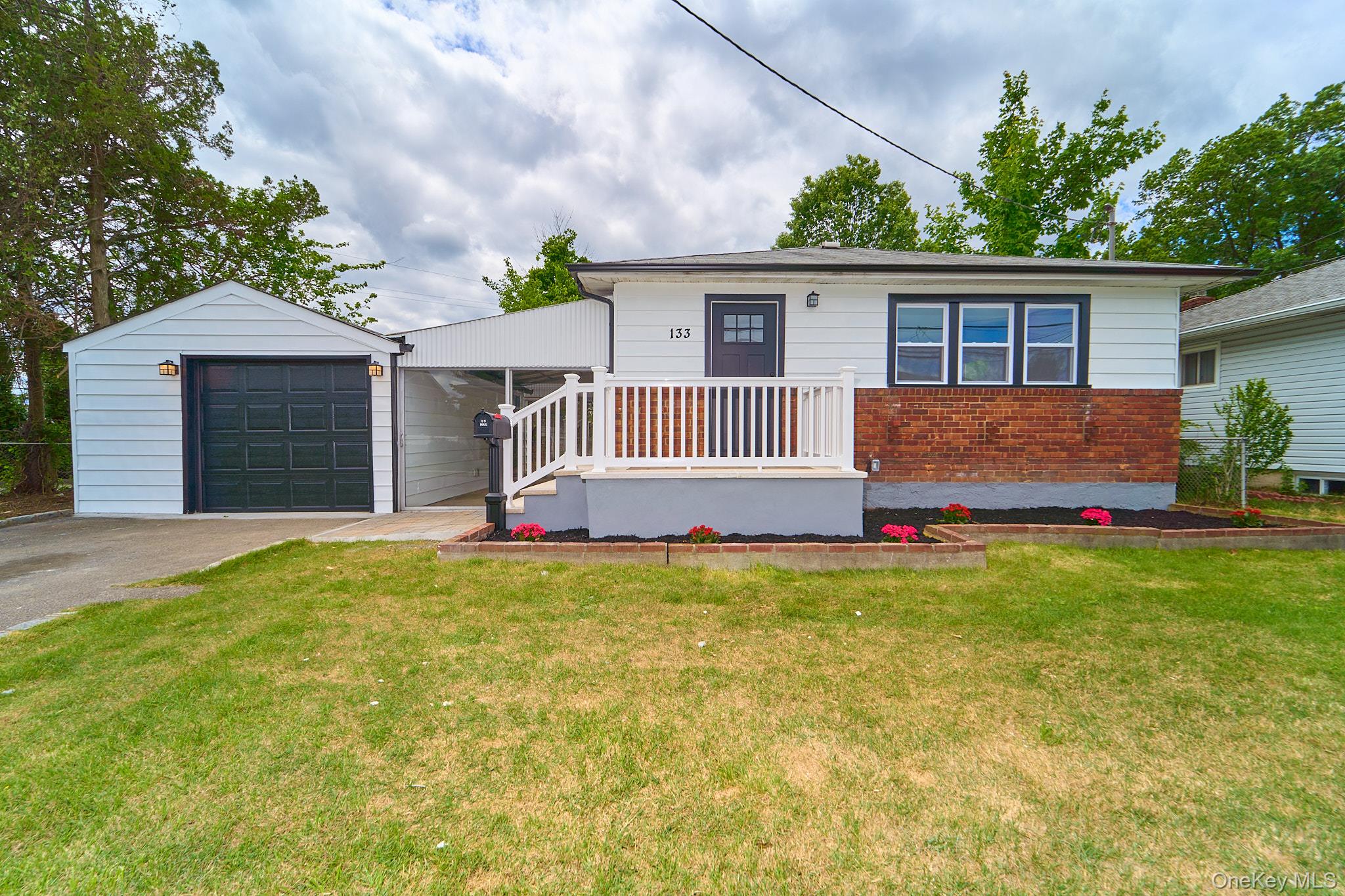 front view of a house with a yard