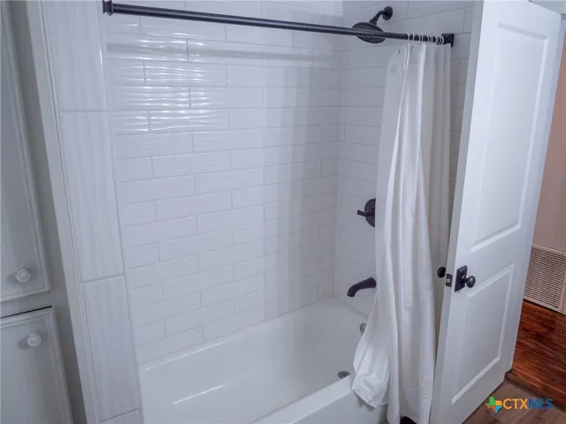 a room with furniture and a potted plant