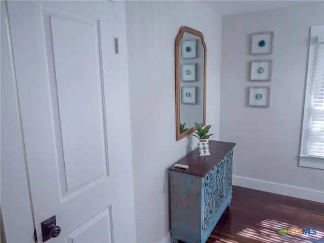 a bedroom with a bed and a lamp