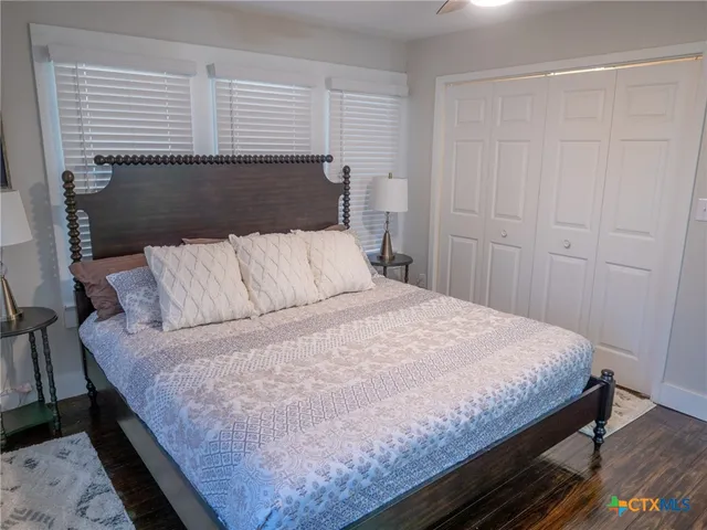 a bedroom with furniture and flat screen tv