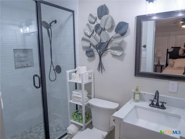 a view of a patio with table and chairs and potted plants