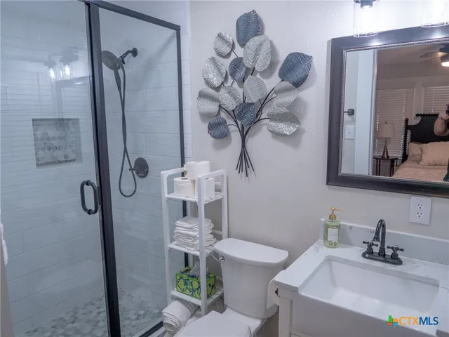 a view of a patio with table and chairs and potted plants