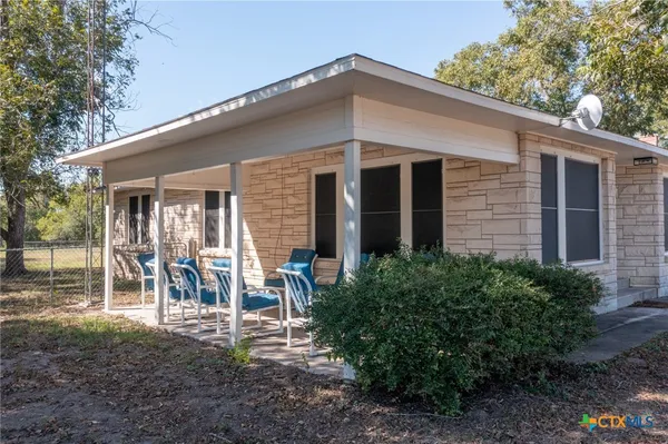 a front view of a house with patio