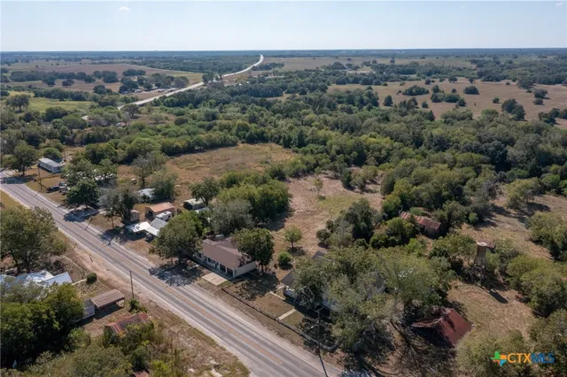 an aerial view of house with yard