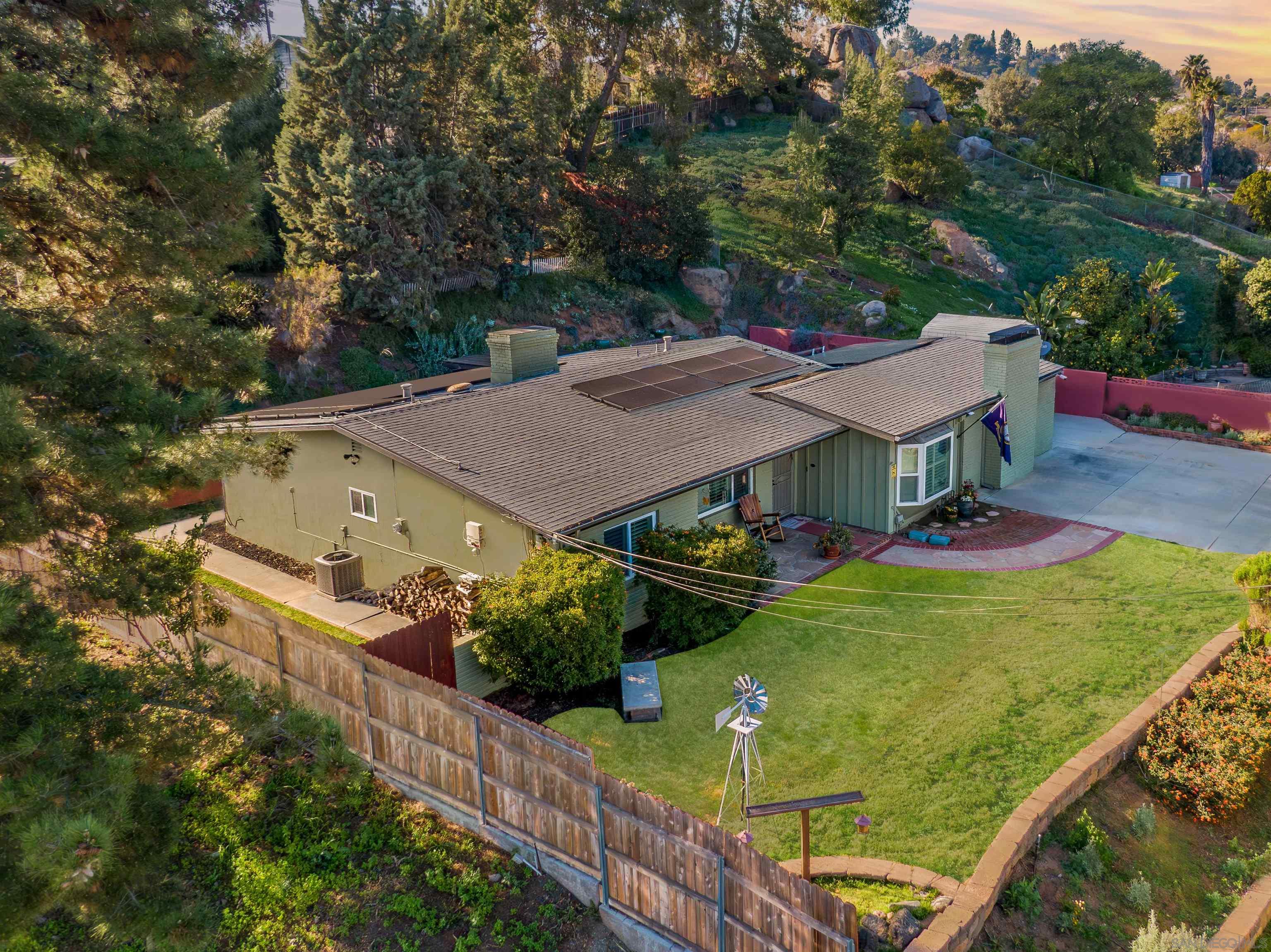 1912 Jalisco Road El Cajon, CA 92019 - Photo 1 of 38 an aerial view of a house with swimming pool and garden