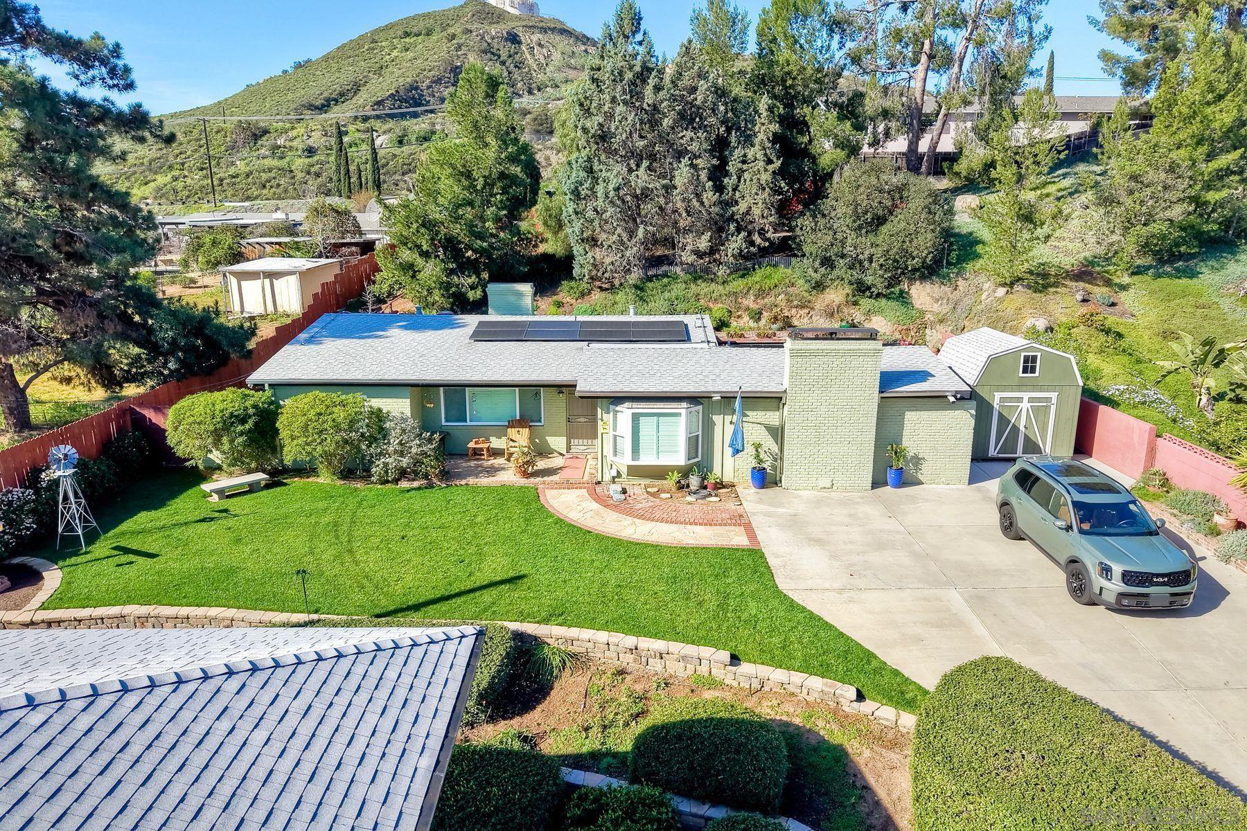 1912 Jalisco Road El Cajon, CA 92019 - Photo 12 of 38 a view of a patio with couches table and chairs and potted plants