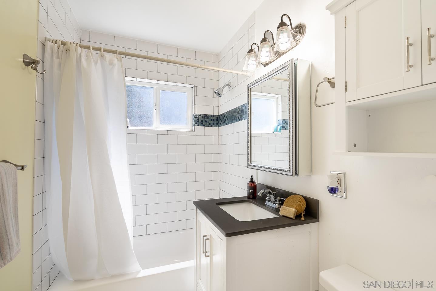 1912 Jalisco Road El Cajon, CA 92019 - Photo 22 of 38 a bathroom with a sink and a mirror