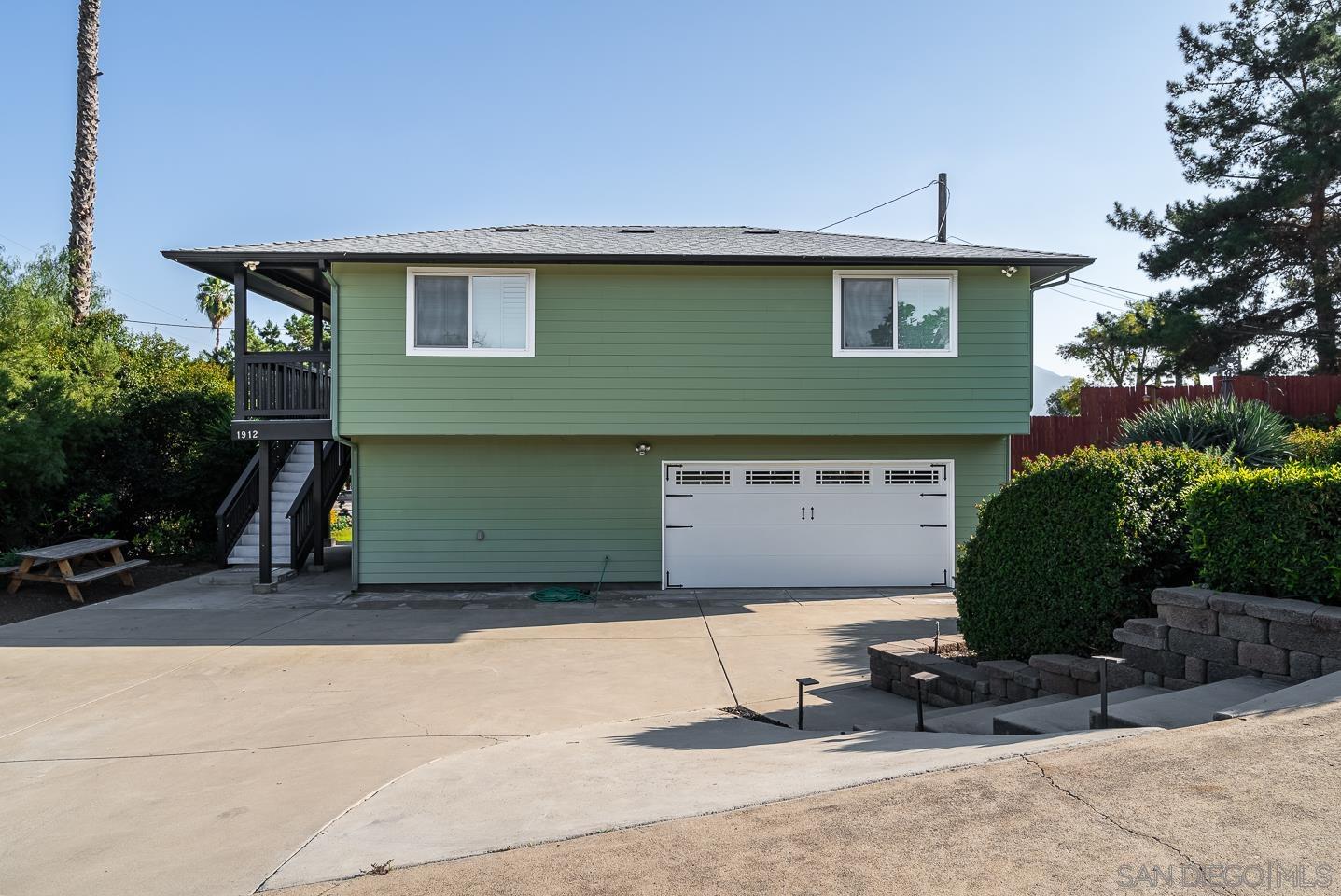 1912 Jalisco Road El Cajon, CA 92019 - Photo 26 of 38 a front view of a house with garage