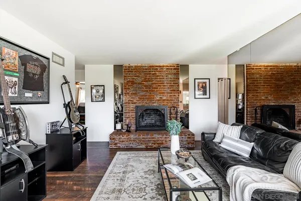 a kitchen with stainless steel appliances kitchen island granite countertop a refrigerator and a stove top oven