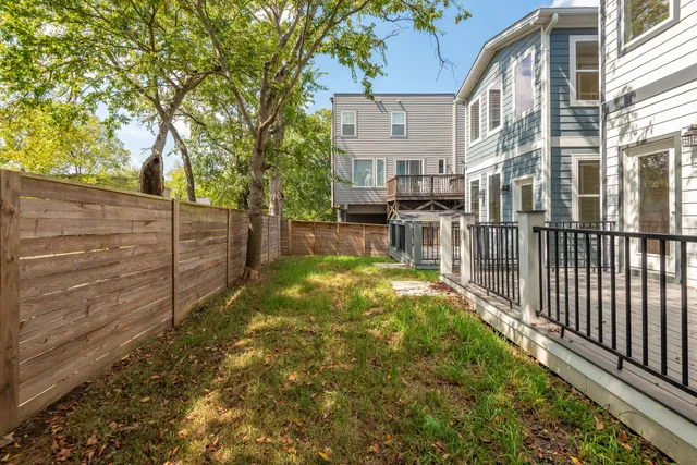 a view of residential house with wooden fence