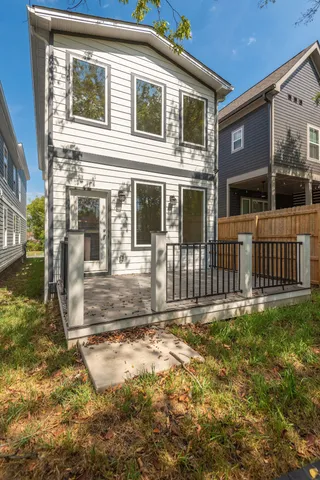 a view of a house with backyard and porch