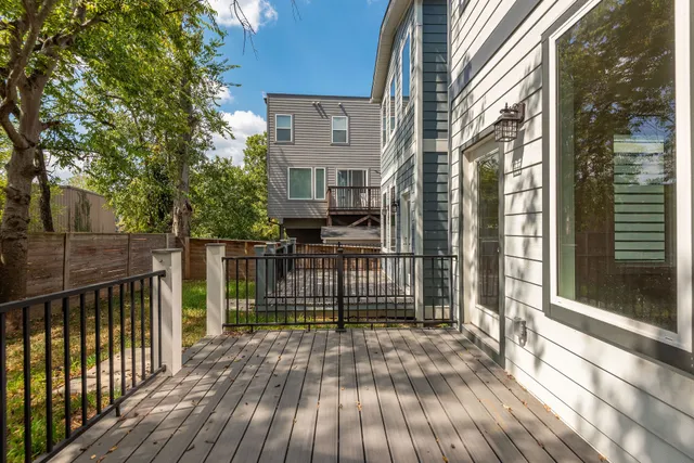 a view of a brick house with a large window
