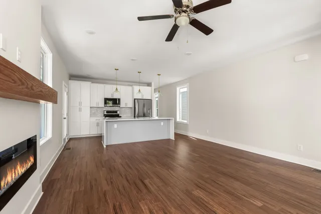 a view of a kitchen with microwave and cabinets