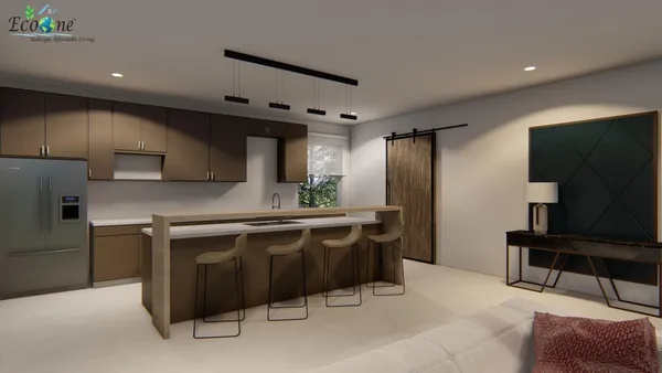 a kitchen with stainless steel appliances a sink a stove a refrigerator and cabinets