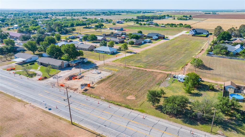 Lot 1 North 1st Street Haskell, TX 79521 - Photo 3 of 3 an aerial view of residential houses with outdoor space and river
