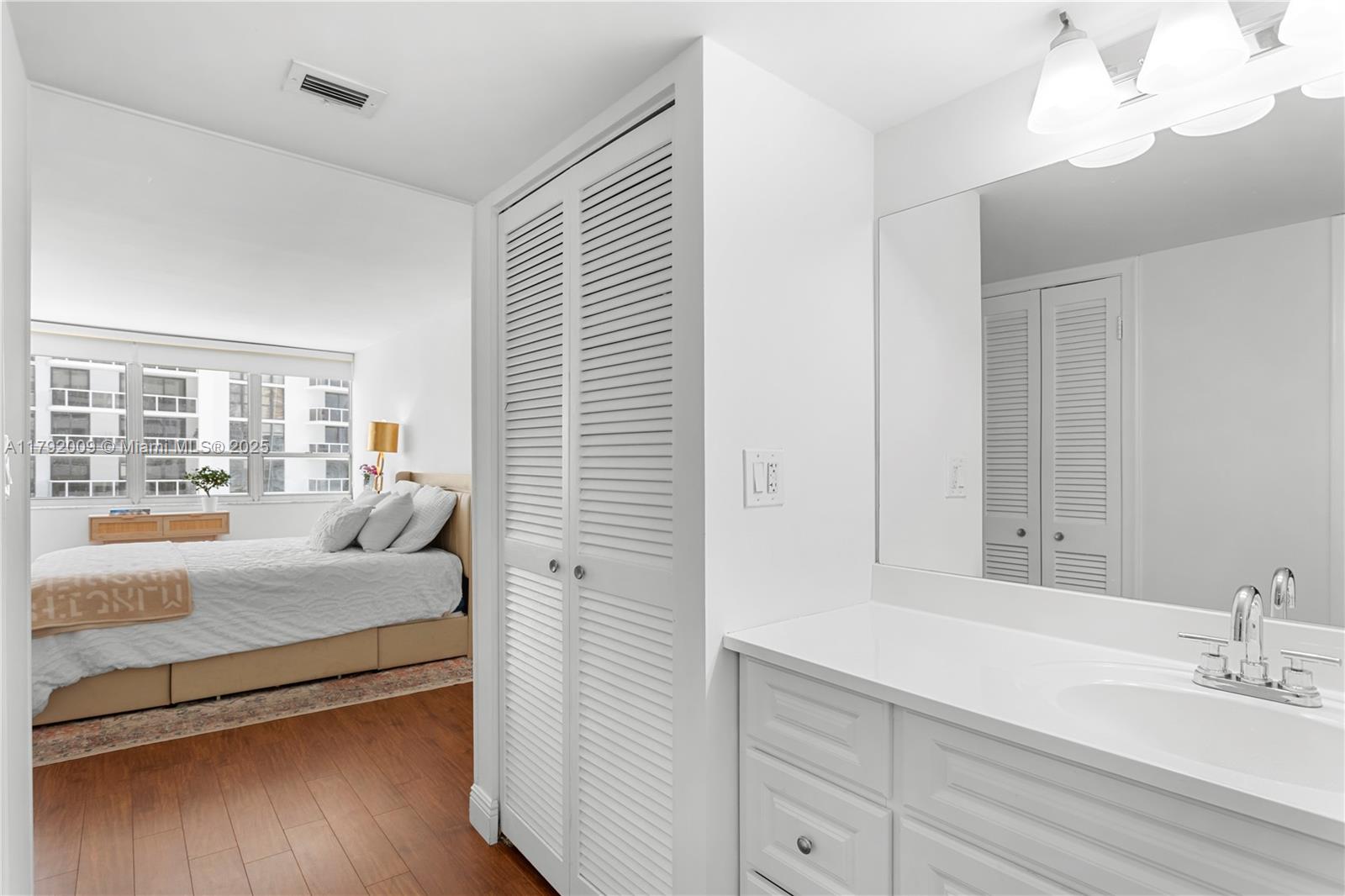 11 Island Avenue, Unit 407 Miami Beach, FL 33139 - Photo 15 of 44 a en suite bathroom with a double vanity sink and large mirror